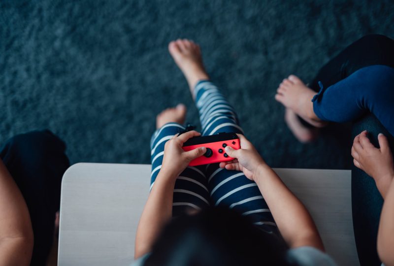 kid holding video game controller